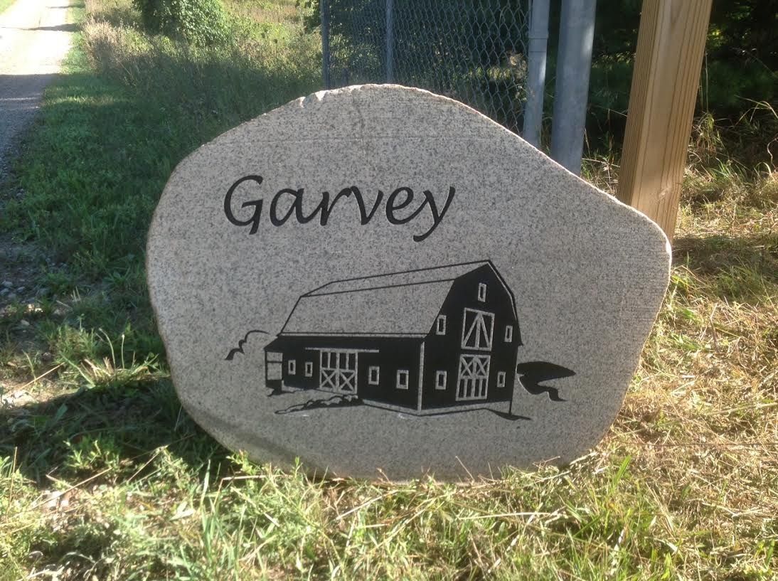 Tan stone sign with the name 