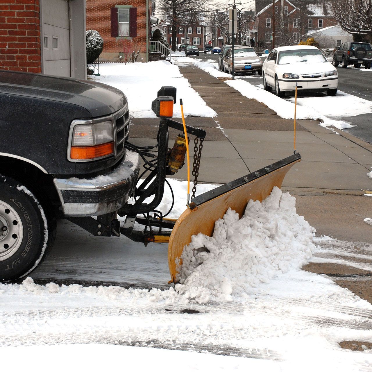 Snow plowing sidewalks.