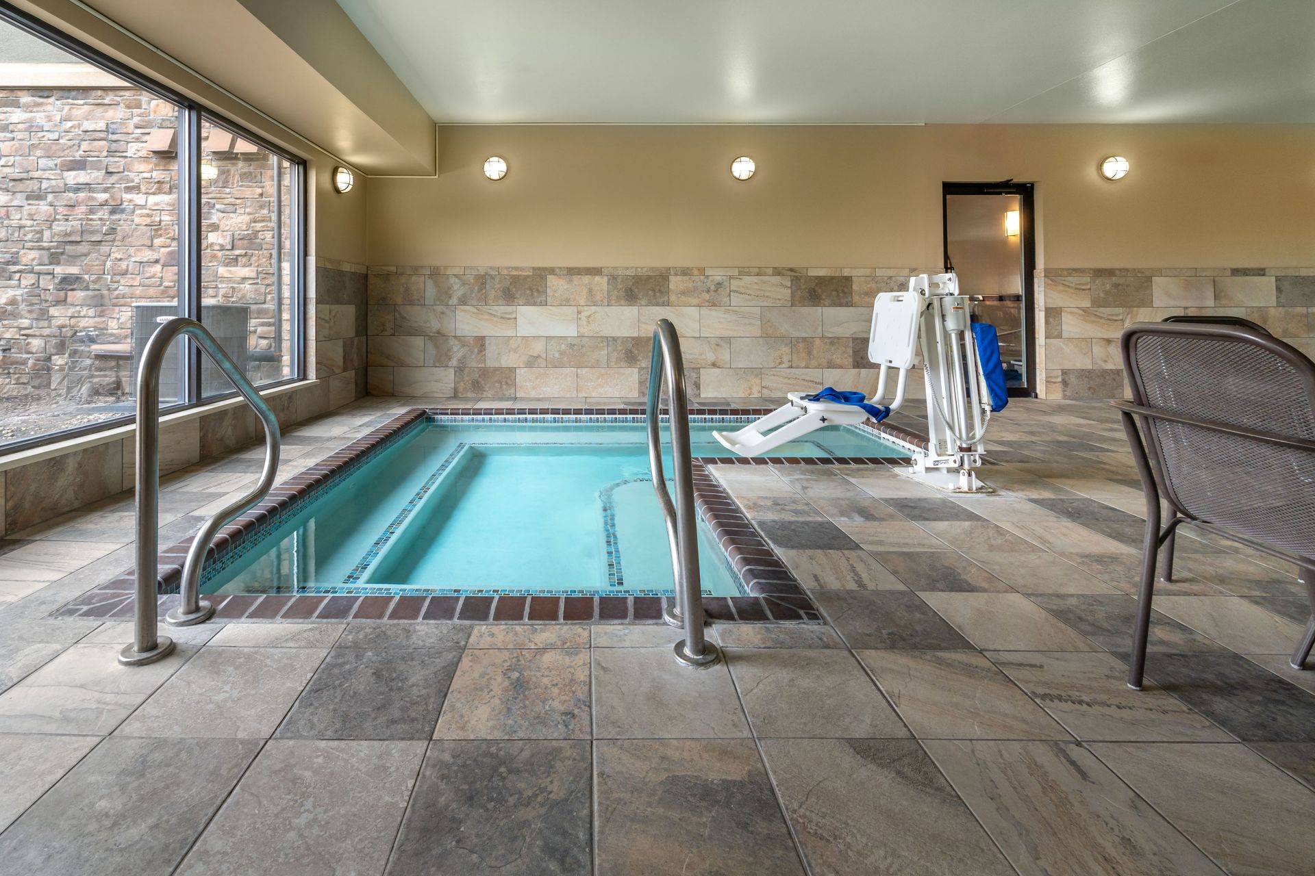 There is a swimming pool in the middle of the room.