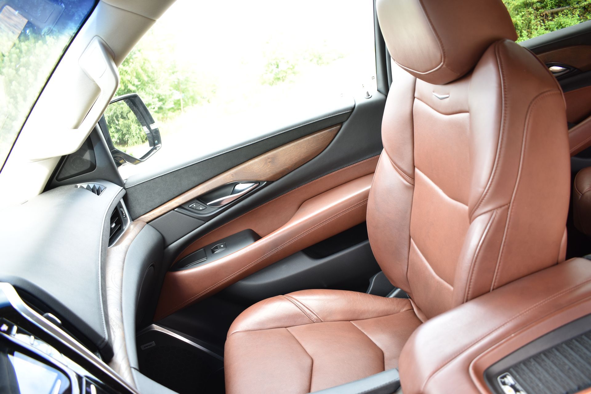 The interior of a car with brown leather seats