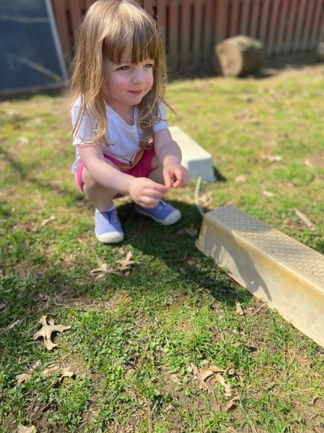 Little kid playing outside