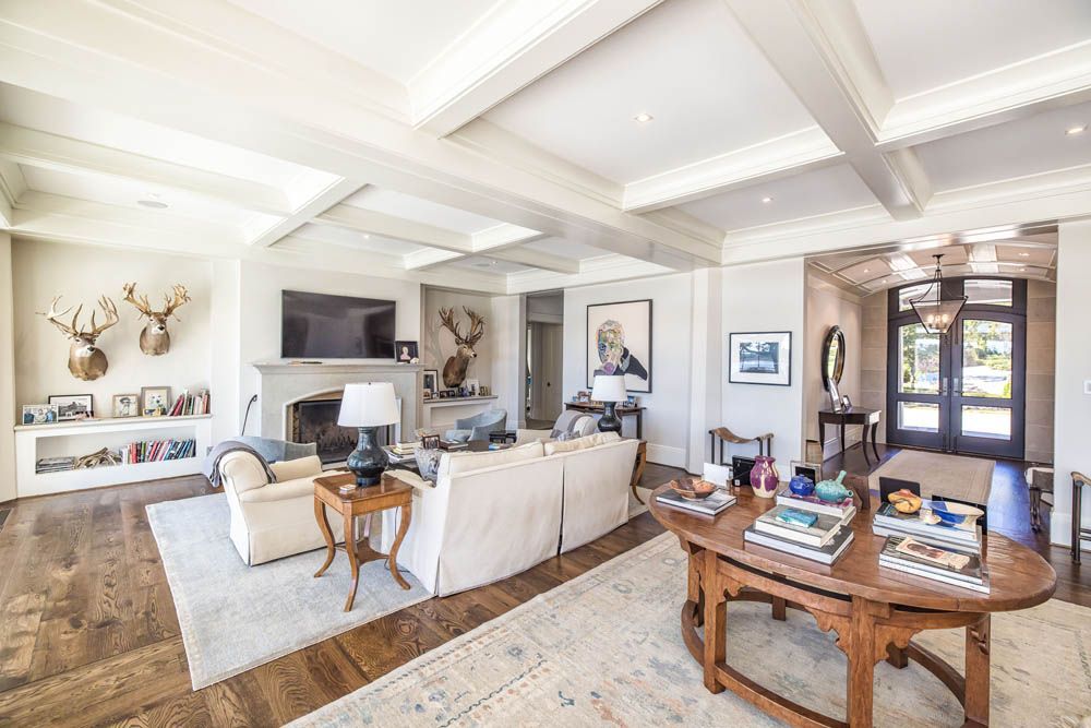 A living room filled with furniture and a fireplace.