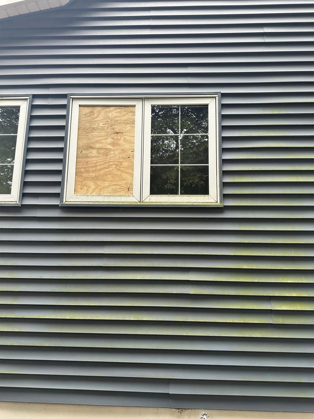 A house with a window on the side of it.