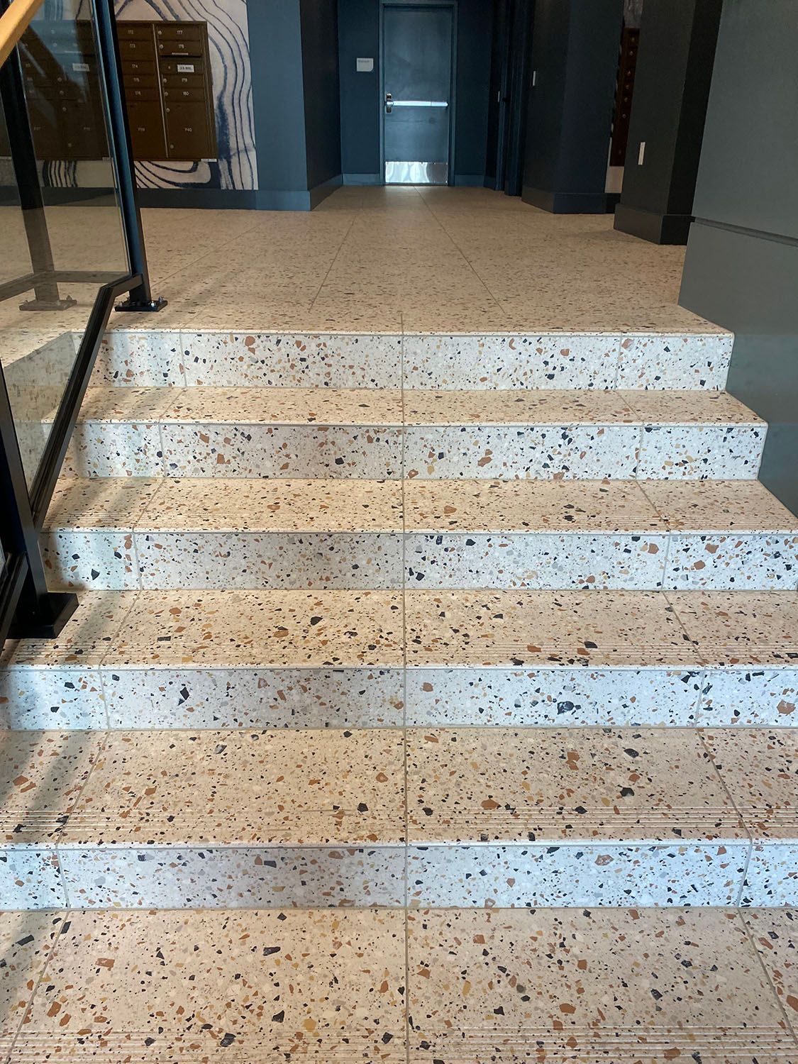 a set of stairs leading up to a door in a building