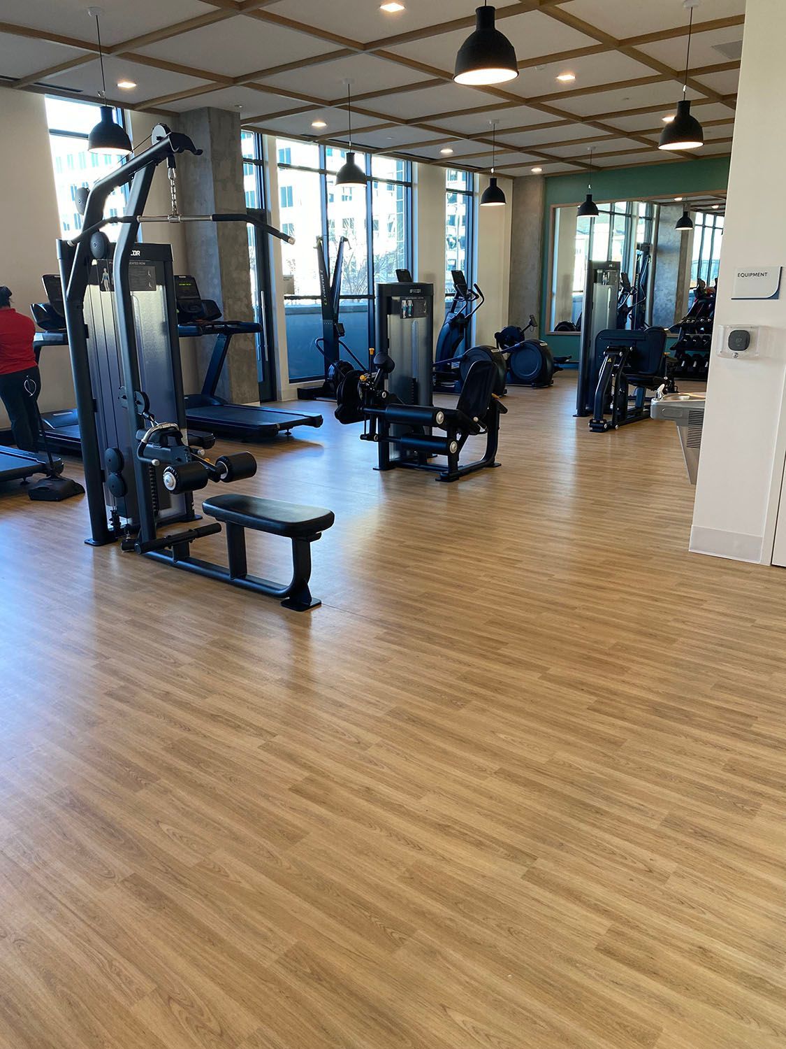 a large gym with a stylish wooden floor