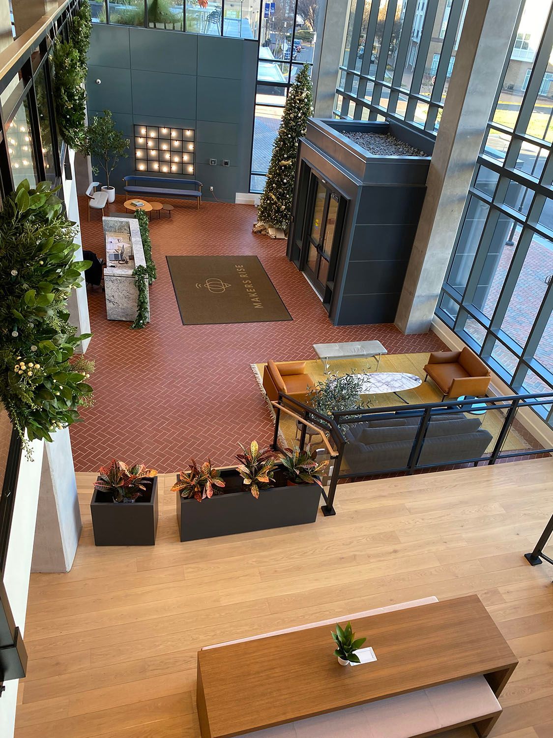 an aerial view of a lobby with a Christmas tree in the middle