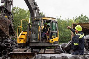 People arranging tires