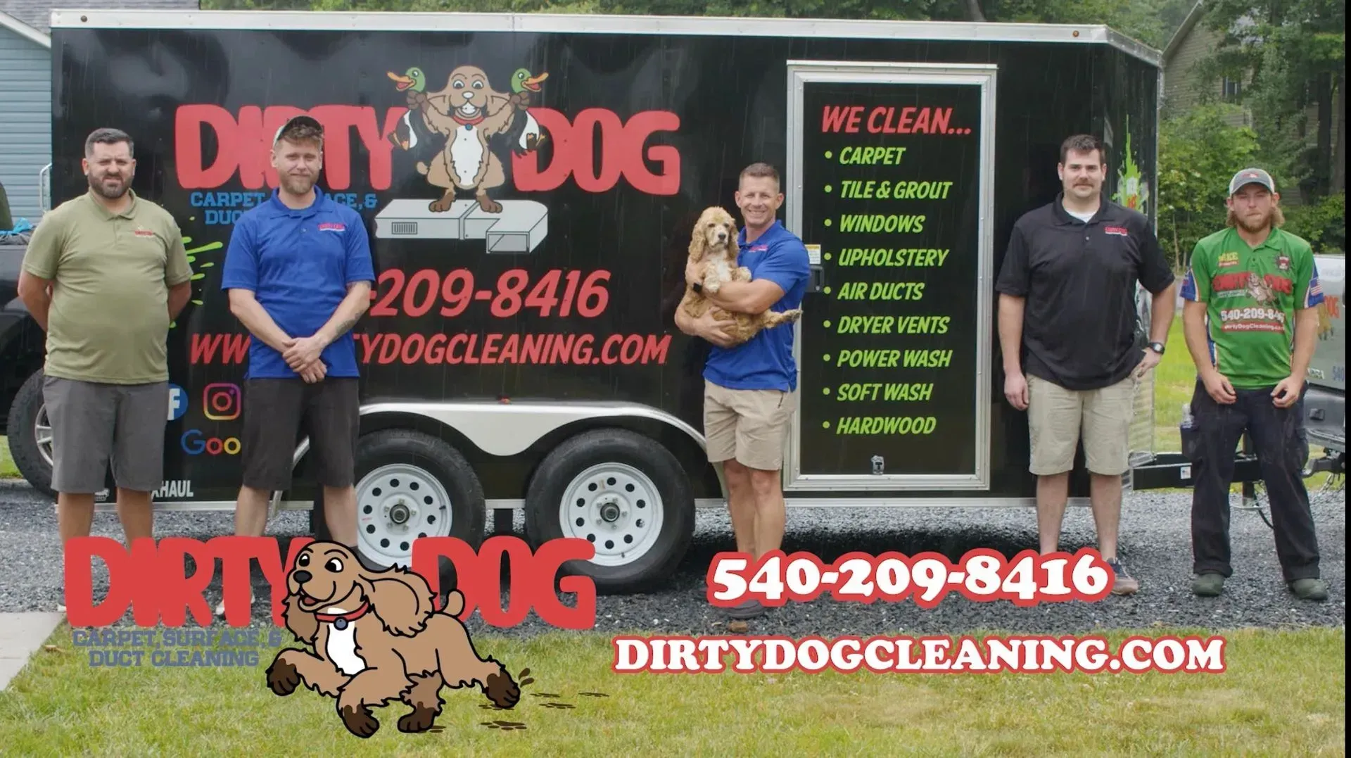 Four people posing beside a Dirty Dog Cleaning truck with a bold black, red, and green company logo and phone number.