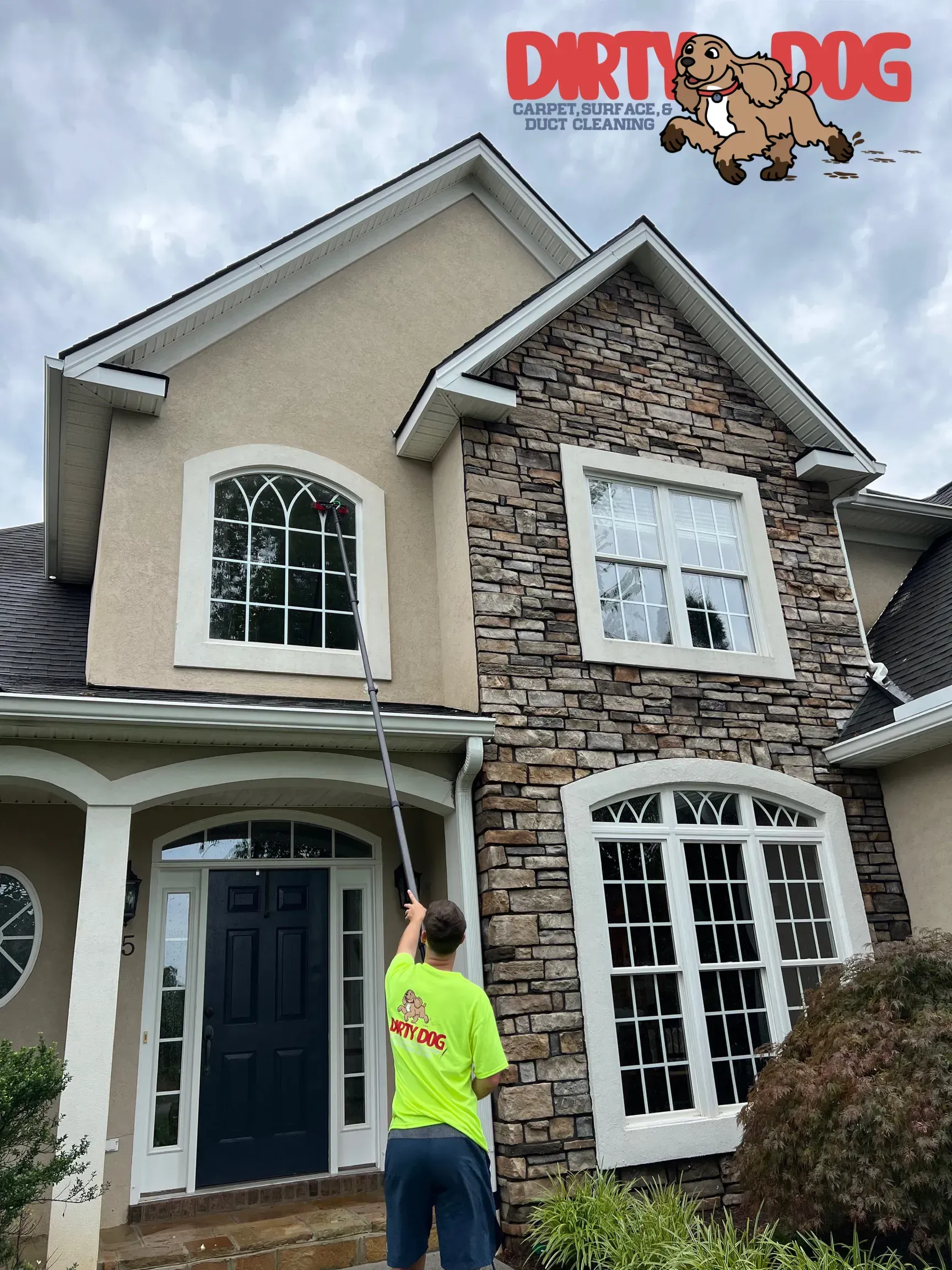 Person in neon shirt standing by a suburban house with a Dirty Dog logo overlay at top right