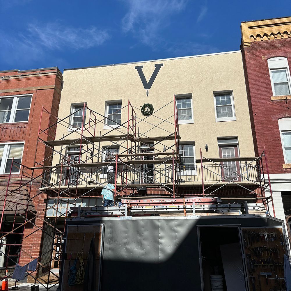 A building with the letter v painted on it