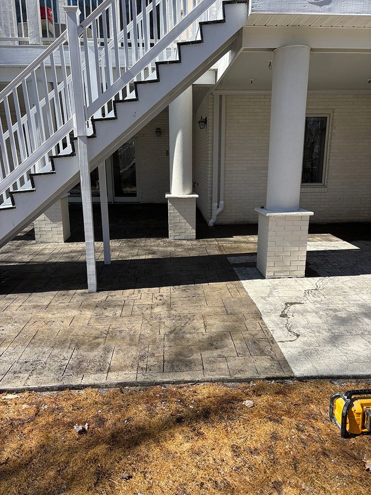 A white staircase is leading up to the second floor of a house.