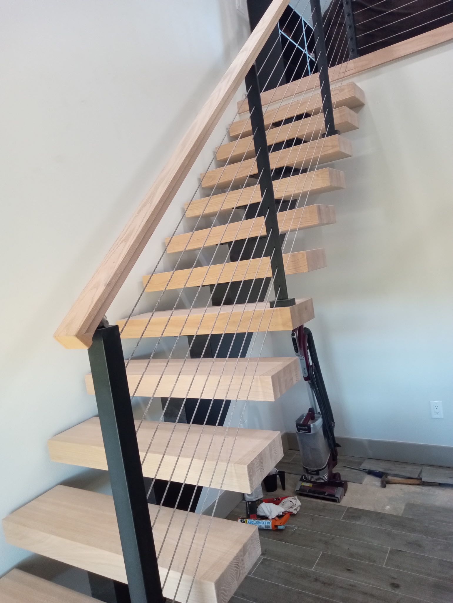 Before picture of a wooden staircase.