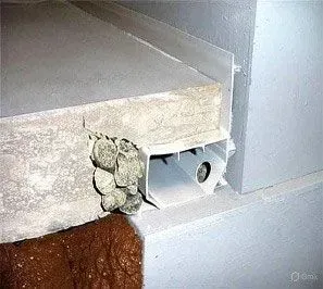 A close up of a concrete floor with a pipe coming out of it