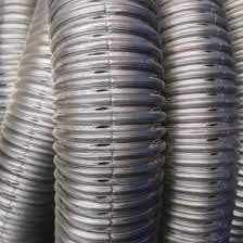 A close up of a bunch of metal pipes stacked on top of each other