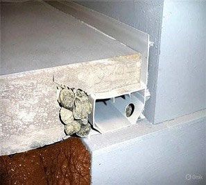 A close up of a concrete floor with a pipe coming out of it
