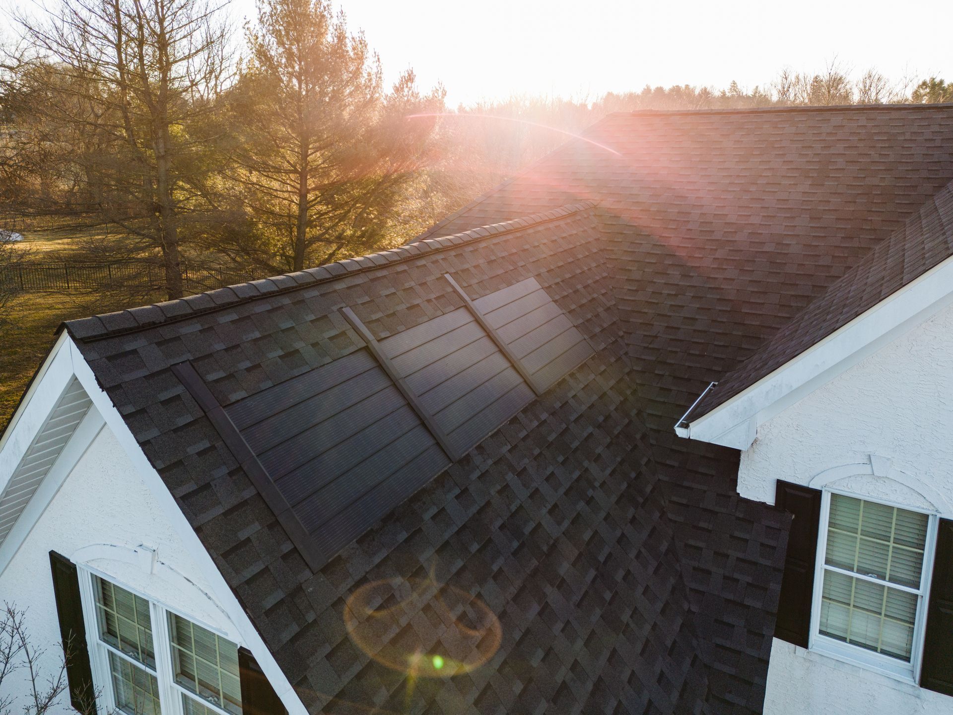 house with solar panels being added