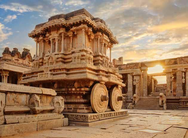 A very old building with wheels on top of it.