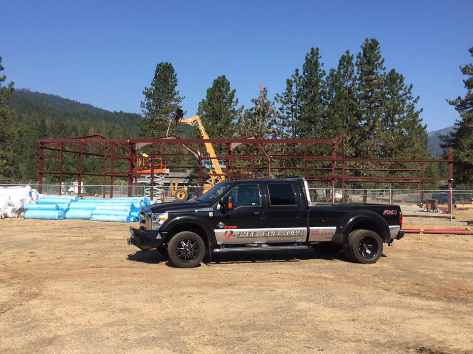 DC Steel Erectors black pickup truck