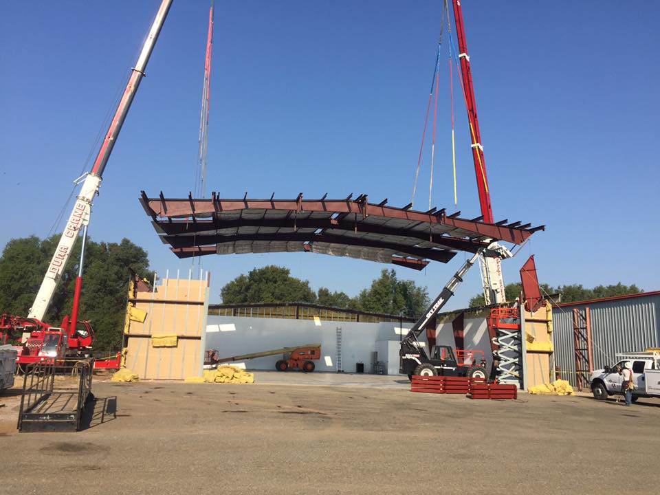 Steel roof being lowered into position 01