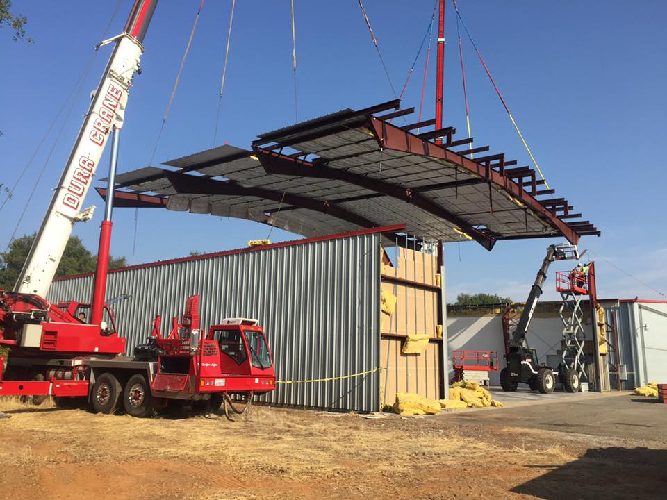 Steel roof being lowered into position 02