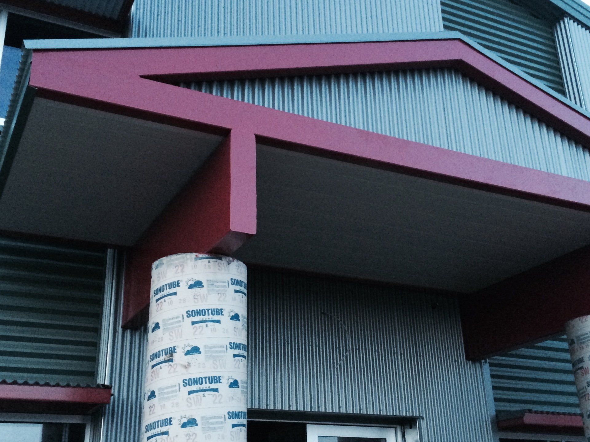 Closeup of outside of steel building overhang