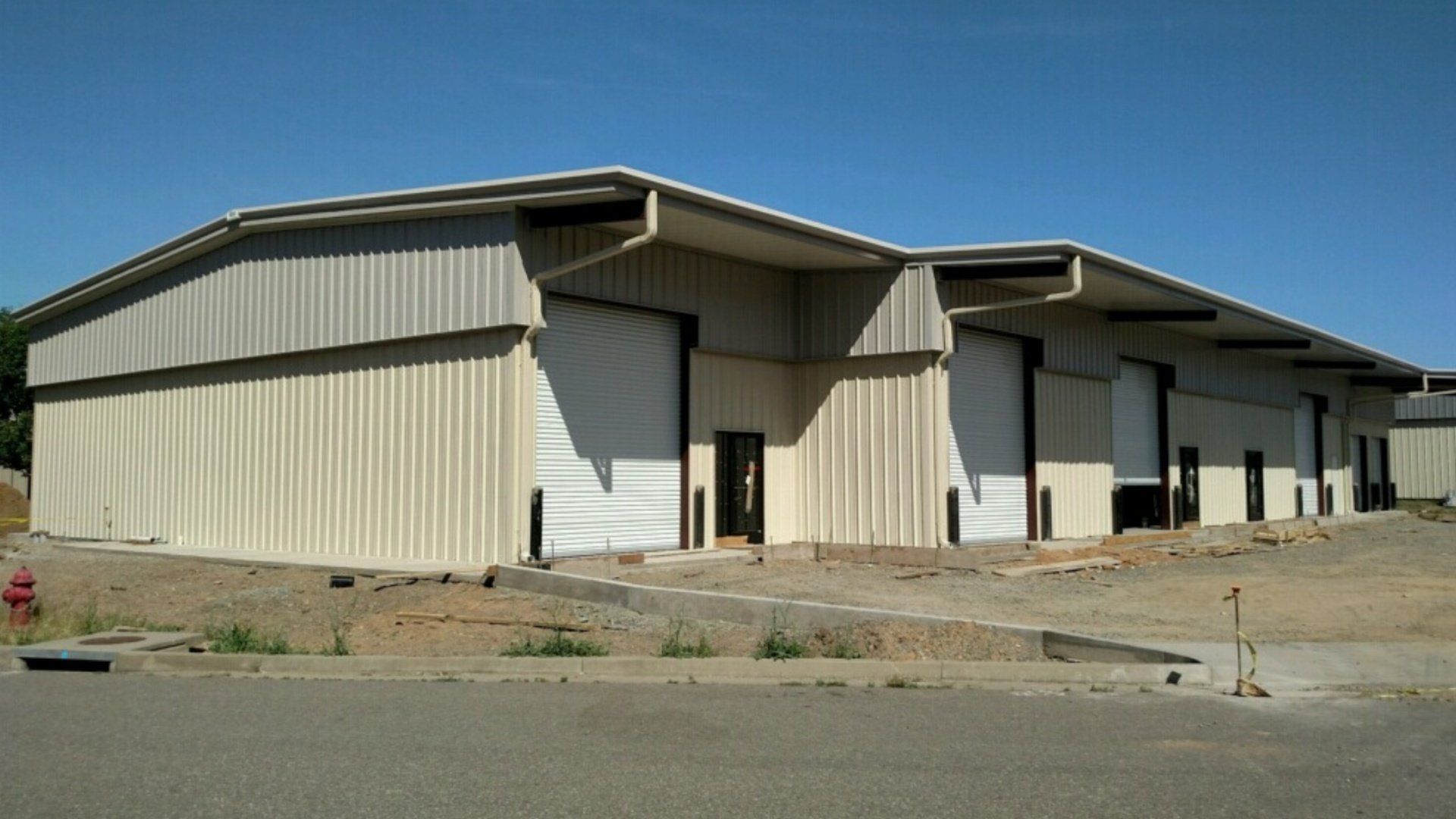 Exterior view of steel building with garage doors