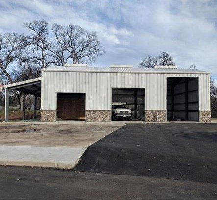 Steel building with open garage doors 01