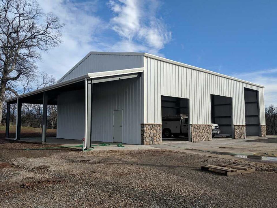 Steel building with open garage doors 02
