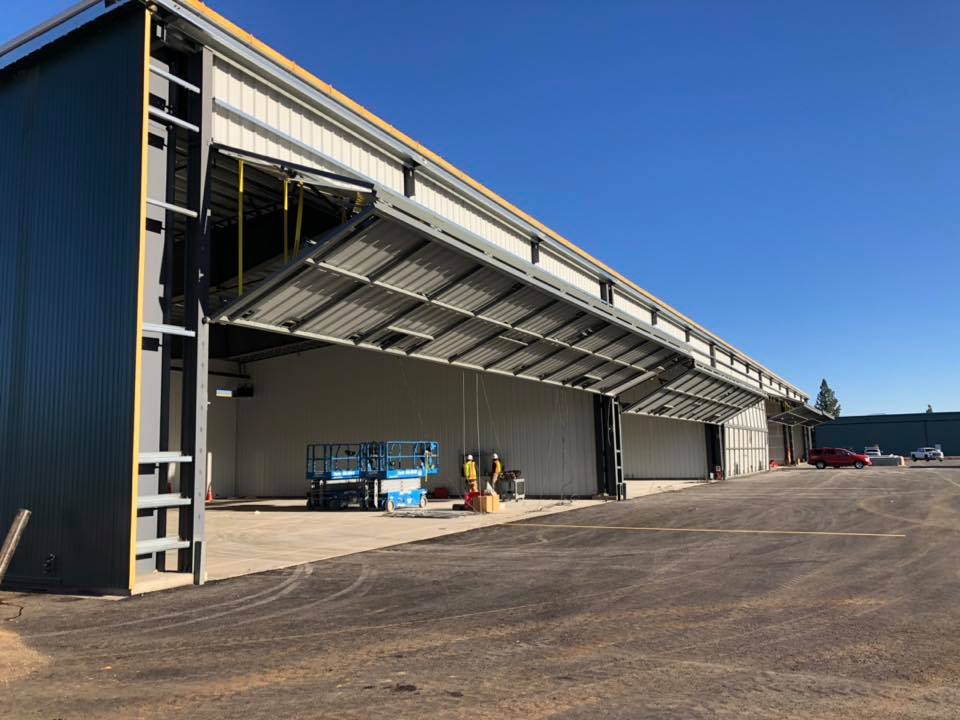 Steel building with large garage openings