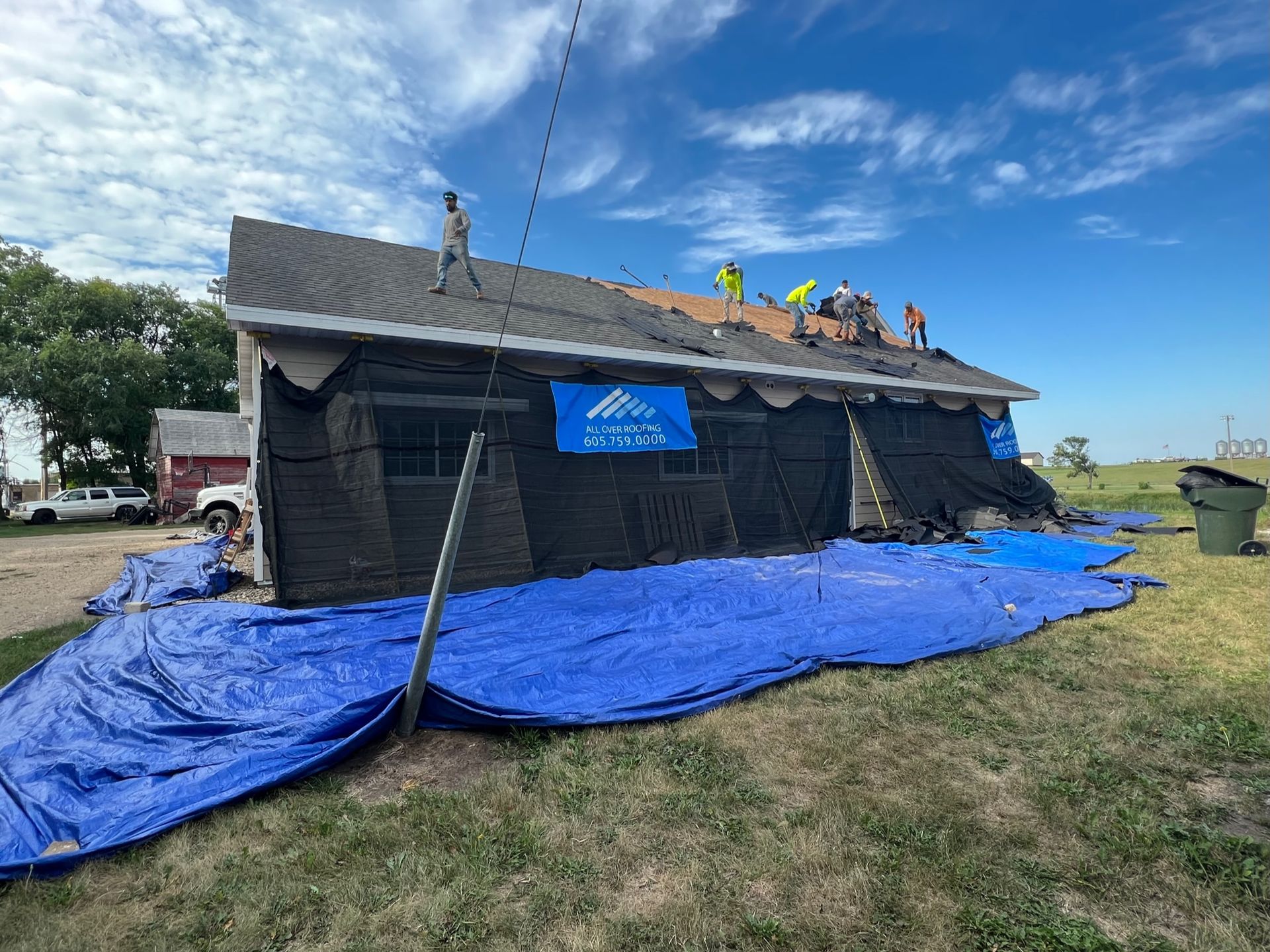 A house is being built with a ladder attached to the side of it.