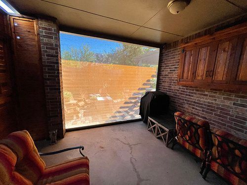 There is a chair and a couch in the room.