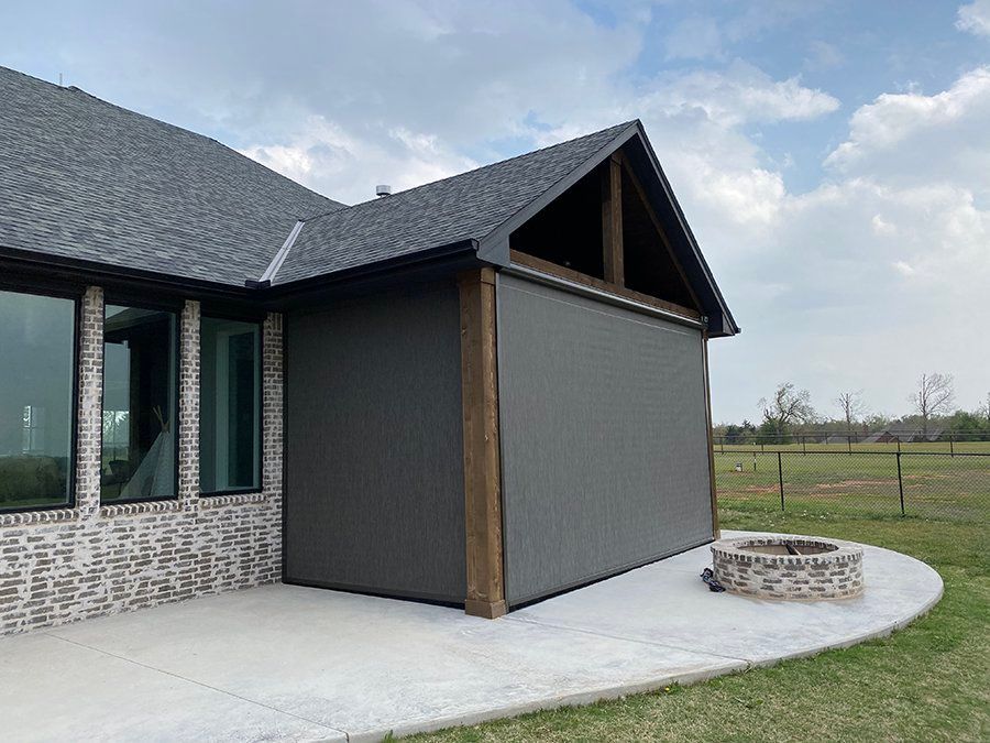 There is a fire pit in the backyard of the house.