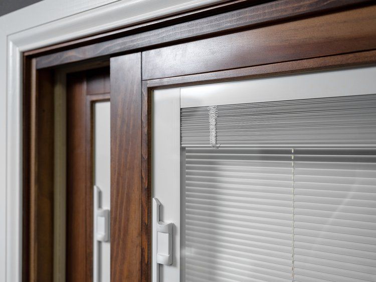 A close up of a window with blinds on it