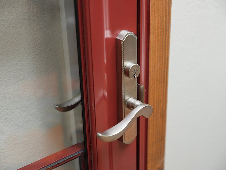 A close up of a door handle with a key on it