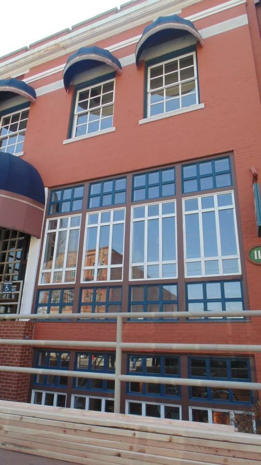 A building with a lot of windows and a sign that says w