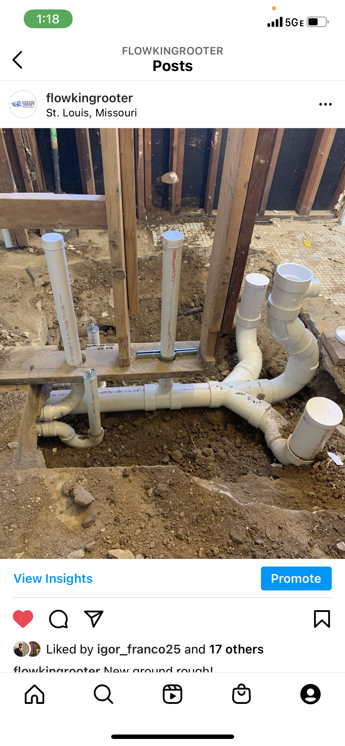 Plumbing pipes installed in a dirt ground, surrounded by wooden beams and framework.