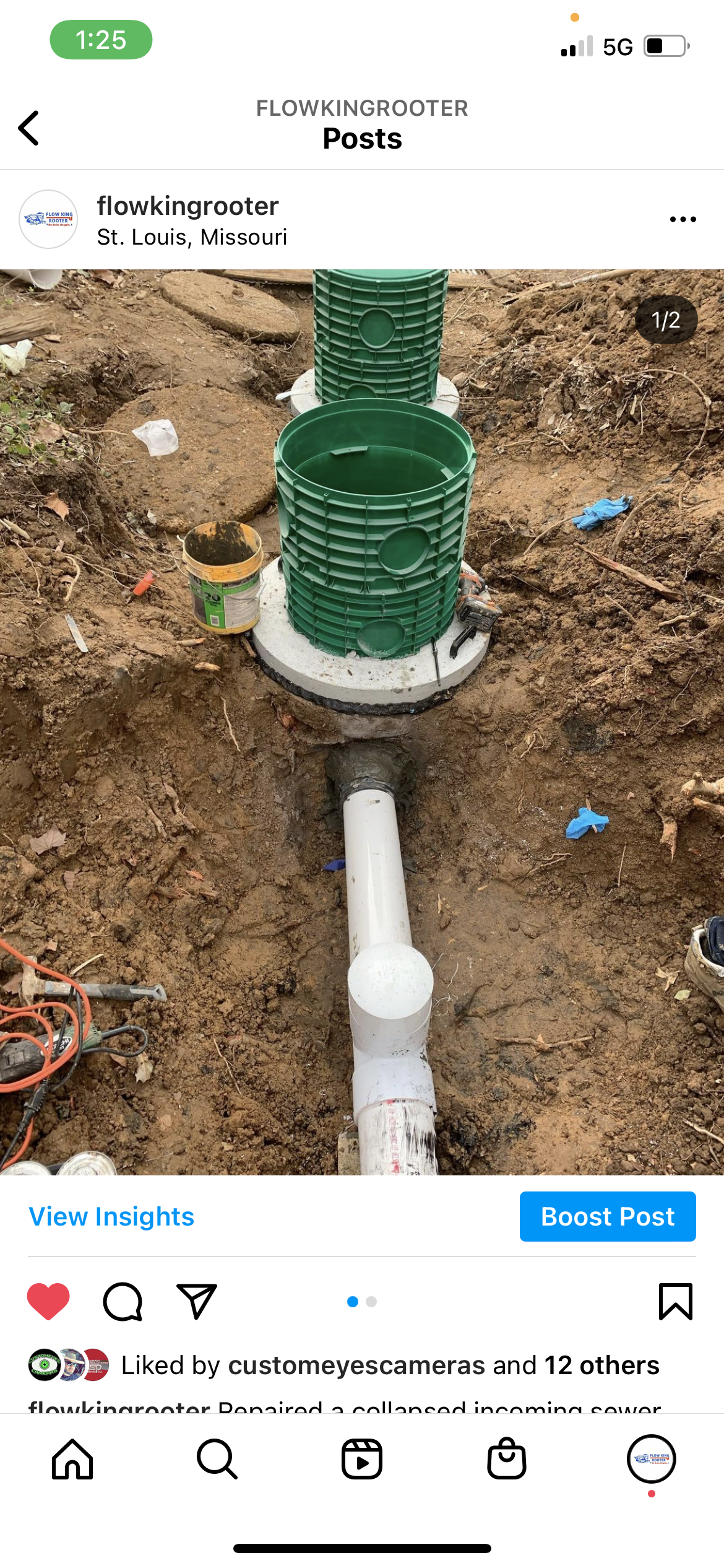 Installation of a green septic tank system with white PVC pipes in a dirt trench.
