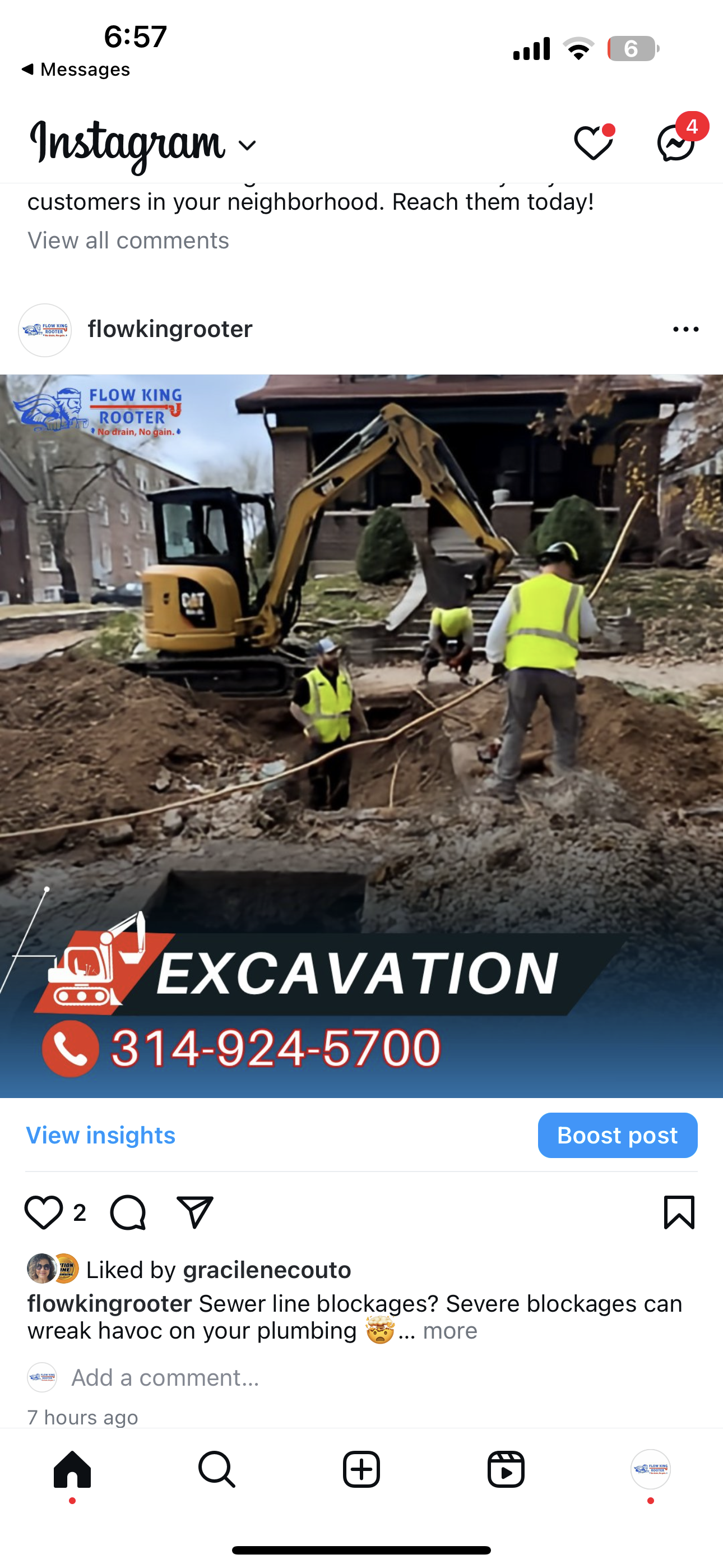 Excavation crew working on a residential lot with heavy machinery and safety vests. Phone number: 314-924-5700.