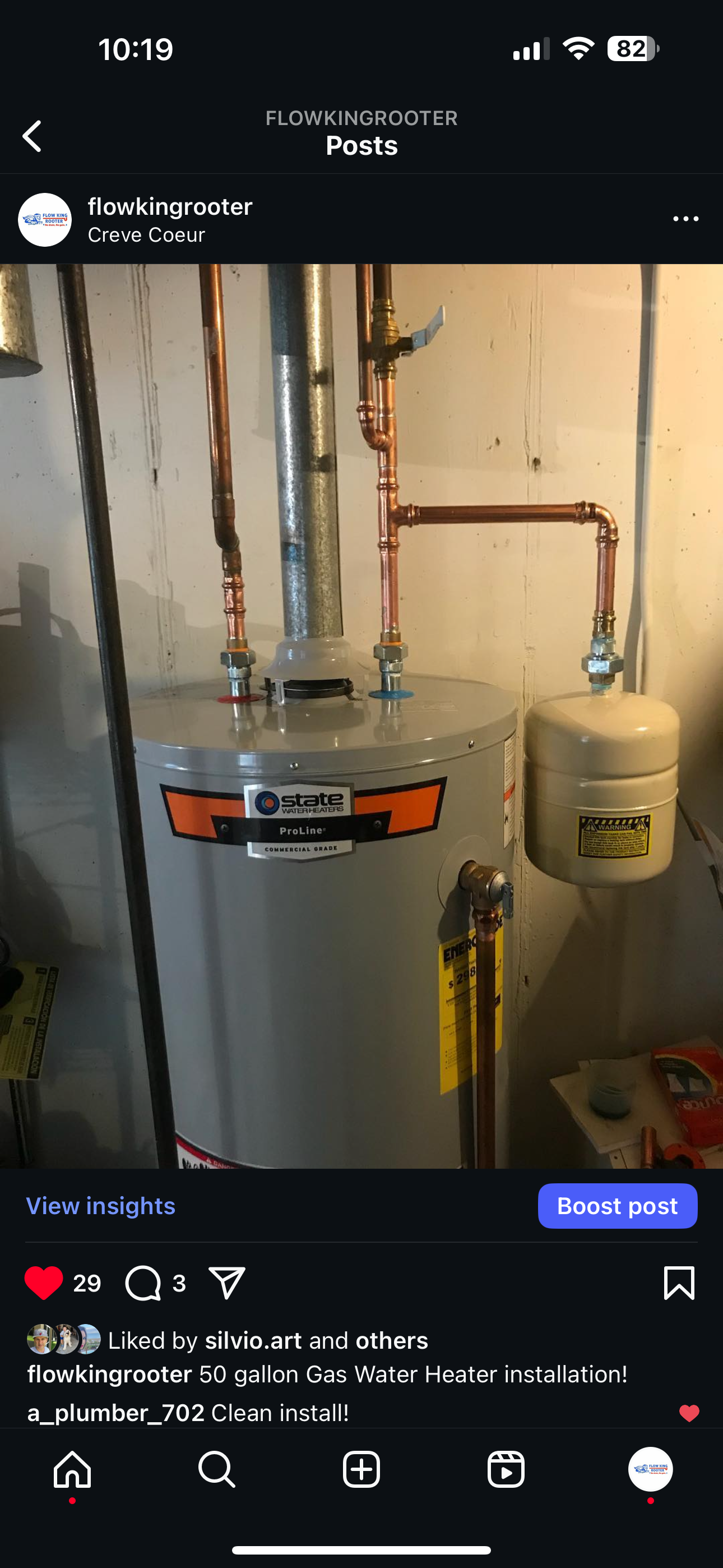 Water heater with copper pipes, installed in a basement.