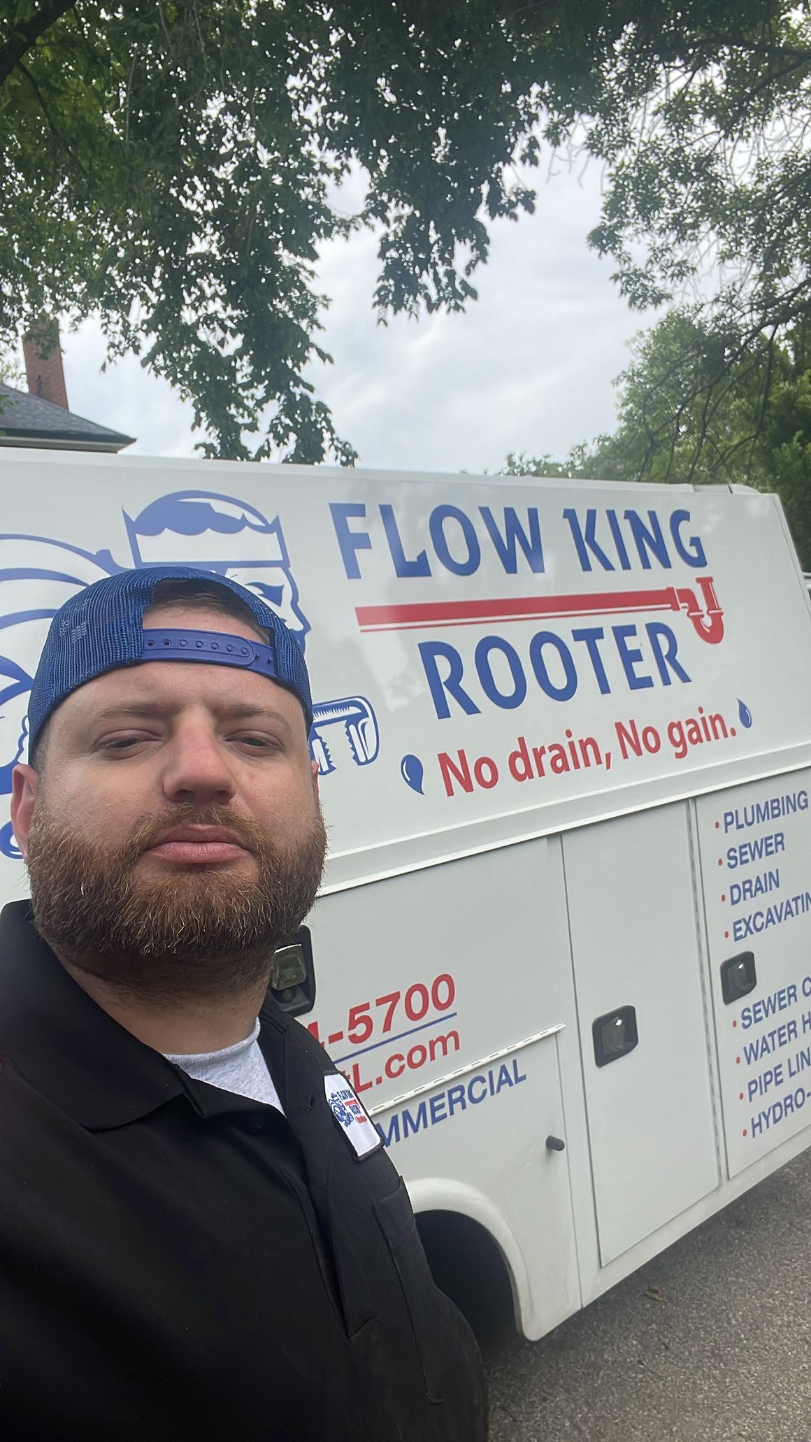 Man in front of a white 