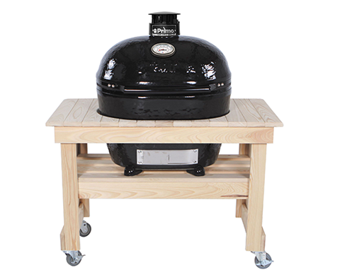 A black grill is sitting on top of a wooden table.