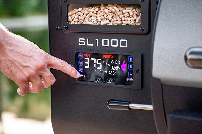 A person is pressing a button on a grill.