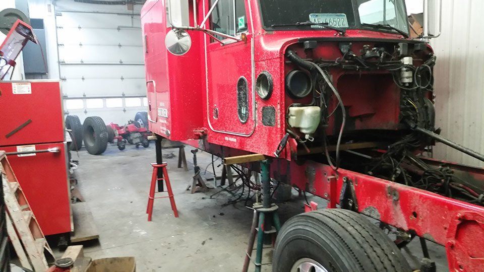 Red truck in shop - before