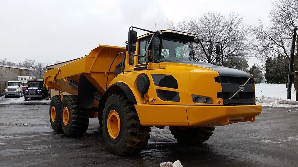 Refinished construction vehicle