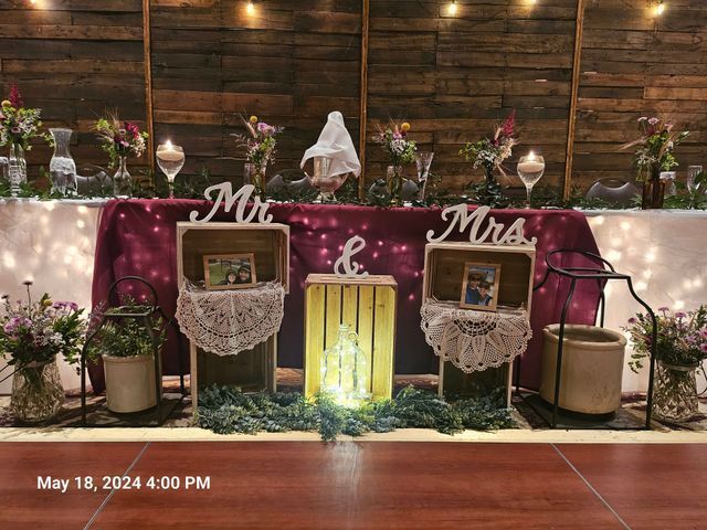 A rustic wedding sweetheart table featuring wooden crates, 