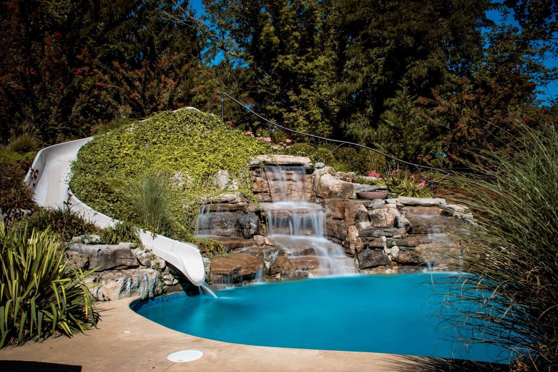 Swimming pool with slide