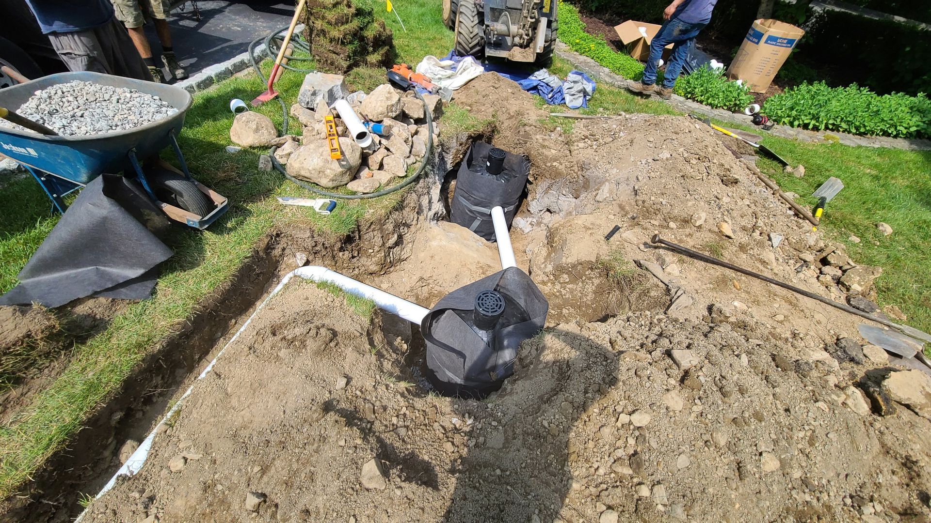 A septic system is being installed in a backyard.