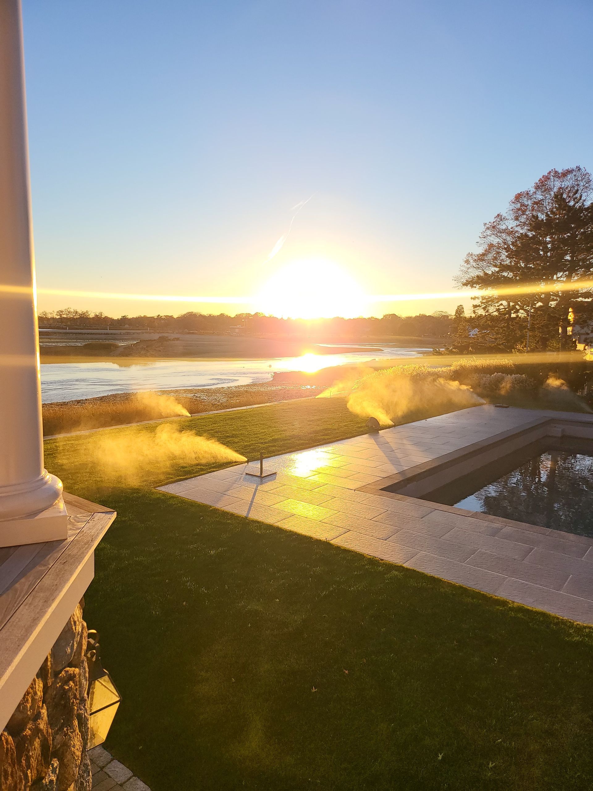 The sun is setting over a body of water