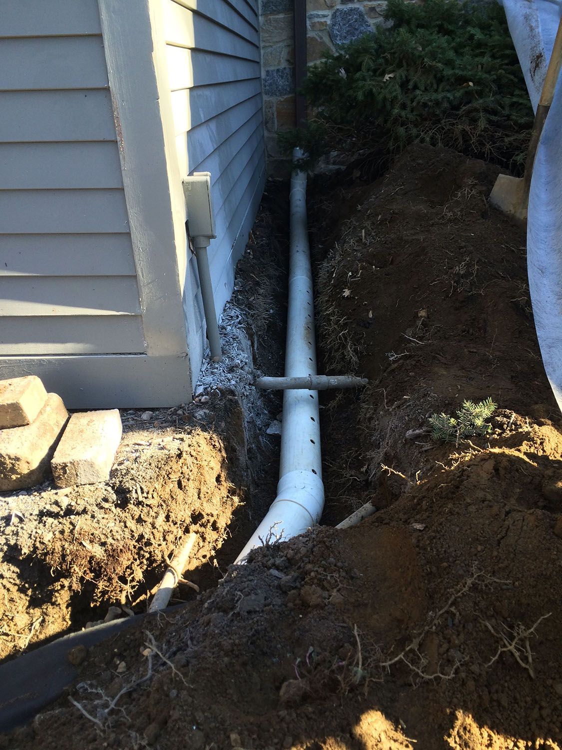 Pipes installed along a drainage trench