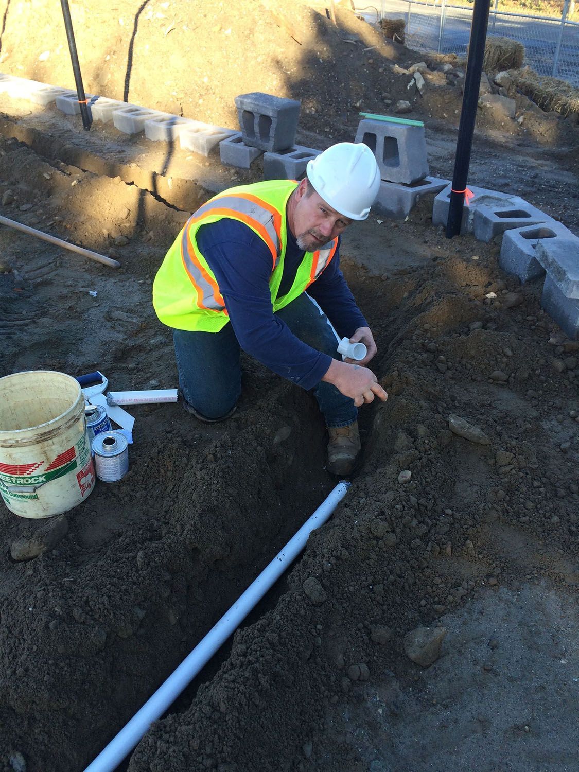 Man connecting 2 pipes